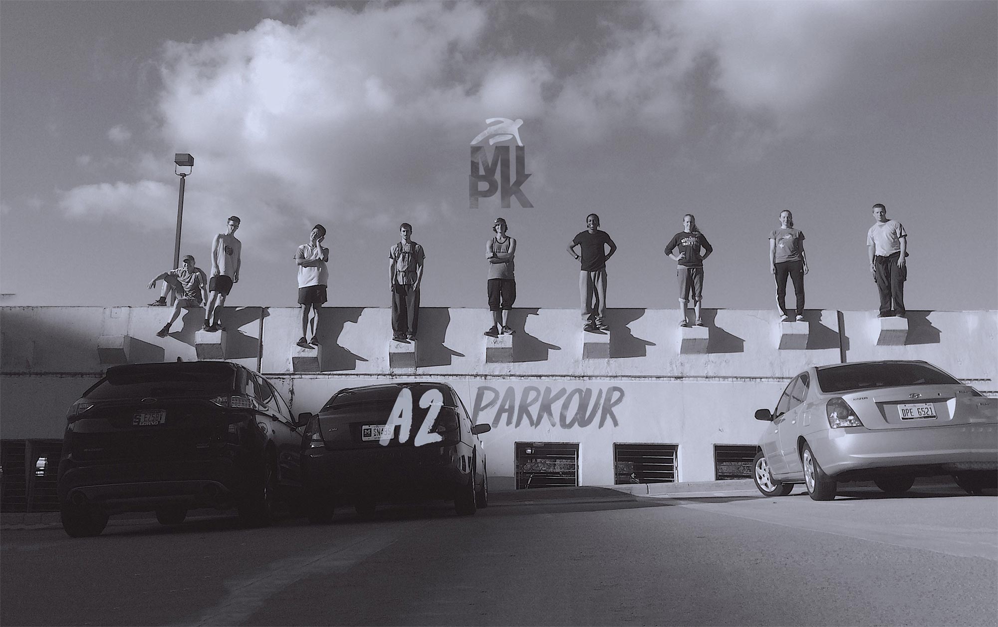 Parkour Participants standing on a wall